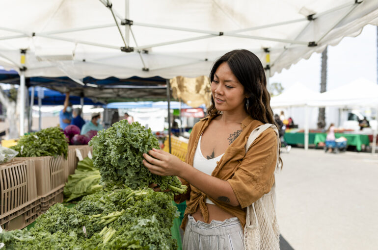 Woman shopping for vegetable, buying at fresh market